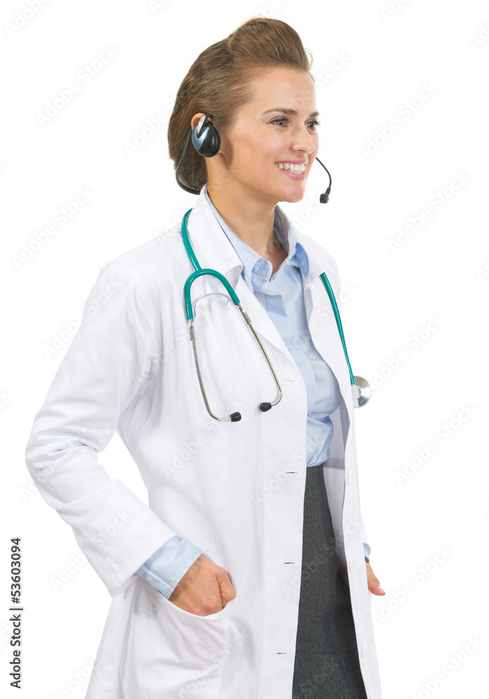 Smiling doctor woman in headset looking on copy space Smiling doctor woman in headset looking on copy space
