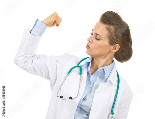 Doctor woman showing biceps