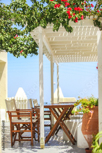 Typical Greek outdoor cafes on the island of Santorini