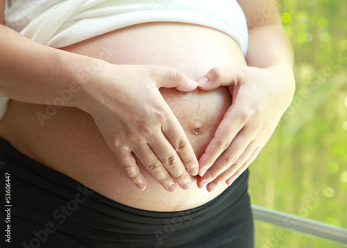Wallpaper Mural pregnant woman with heart sharp Torontodigital.ca