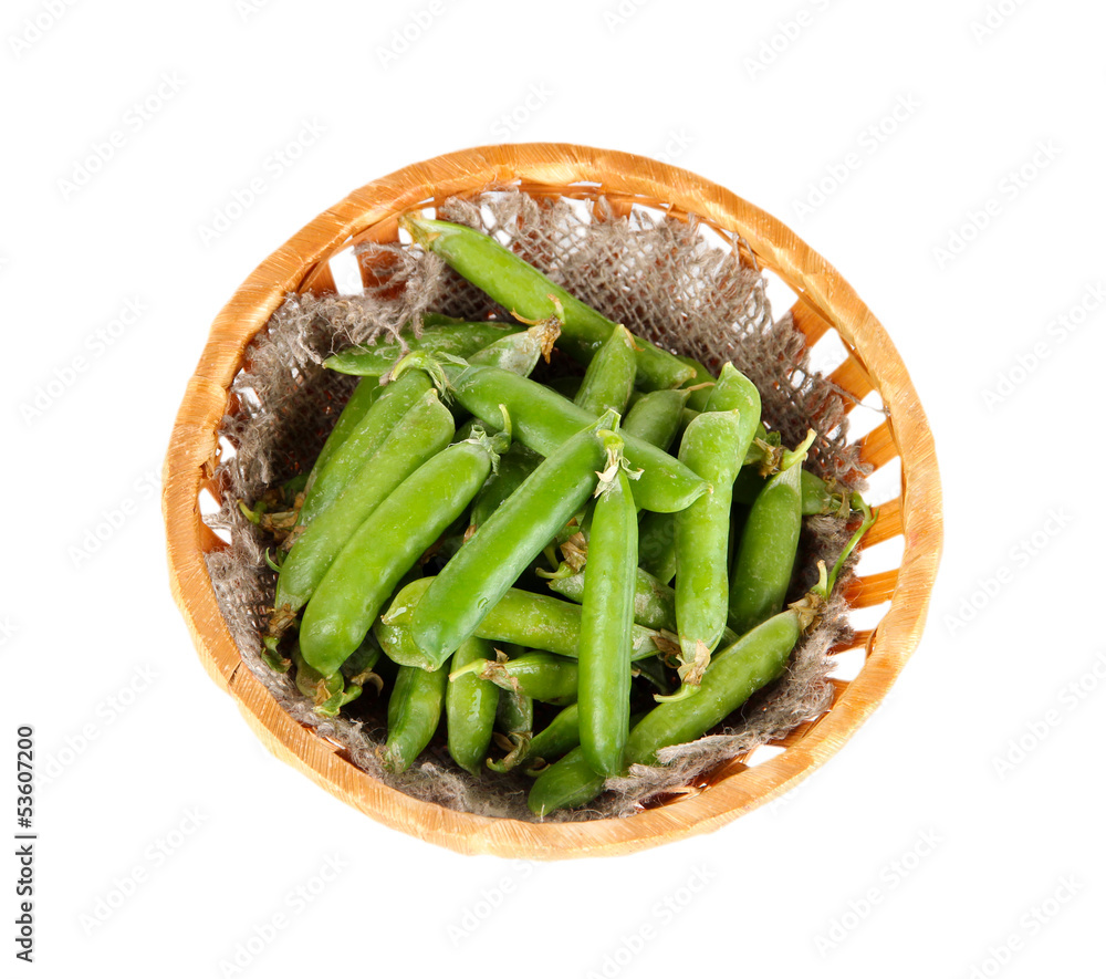 Green peas in basket isolated on white Green peas in basket isolated on white