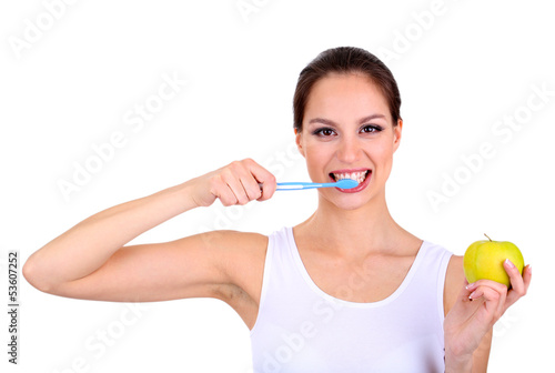 Smiling woman with apple and toothbrush isolated on white