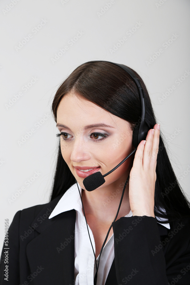 Call center operator, on gray background Call center operator, on gray background