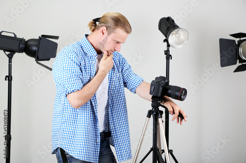 Handsome photographer with ...