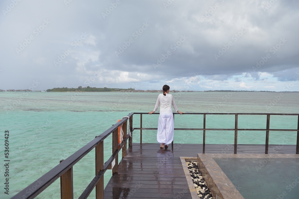 young woman relax on cloudy summer day