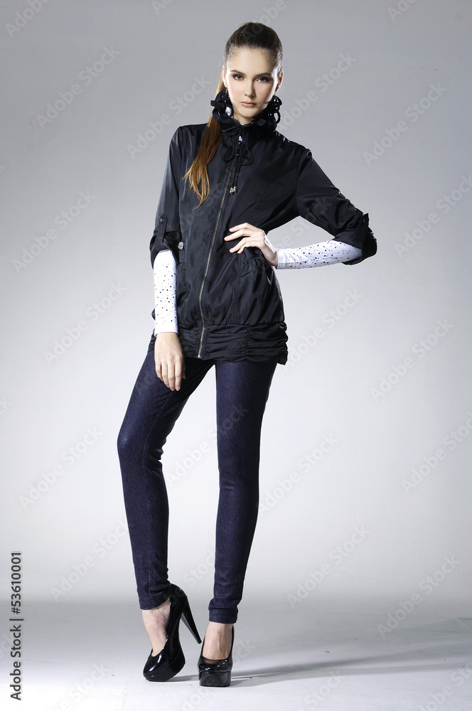 full-length portrait of young model posing on light background full-length portrait of young model posing on light background