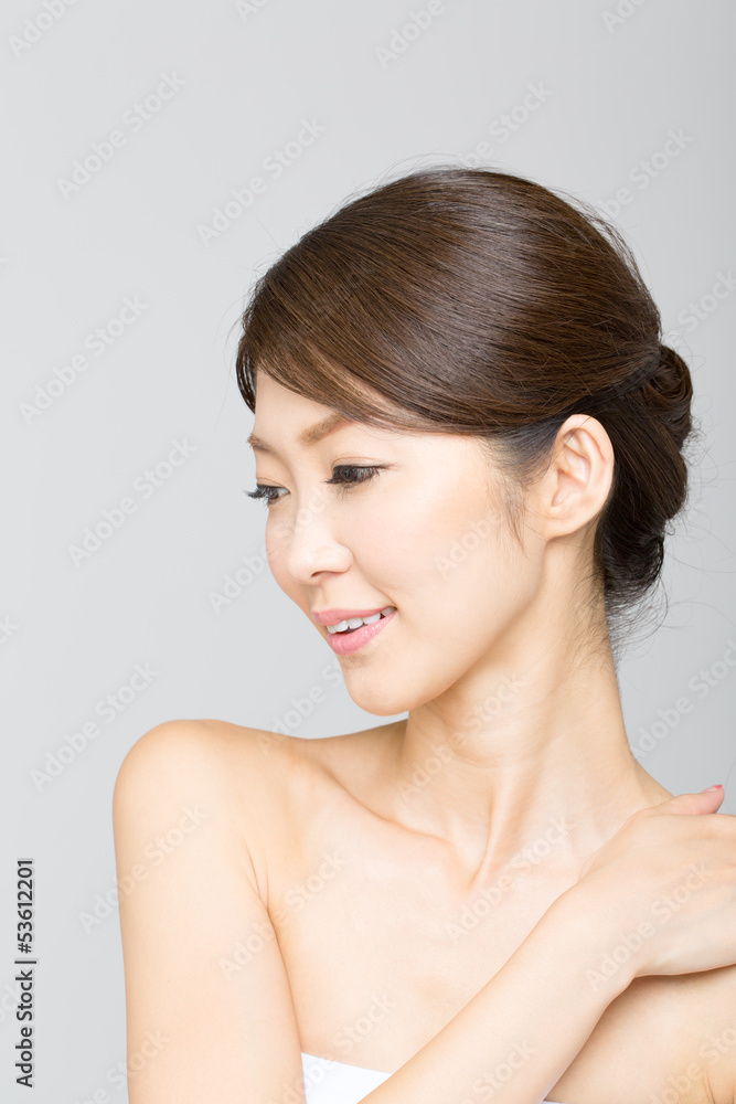 Beautiful asian woman isolated on gray background Beautiful asian woman isolated on gray background
