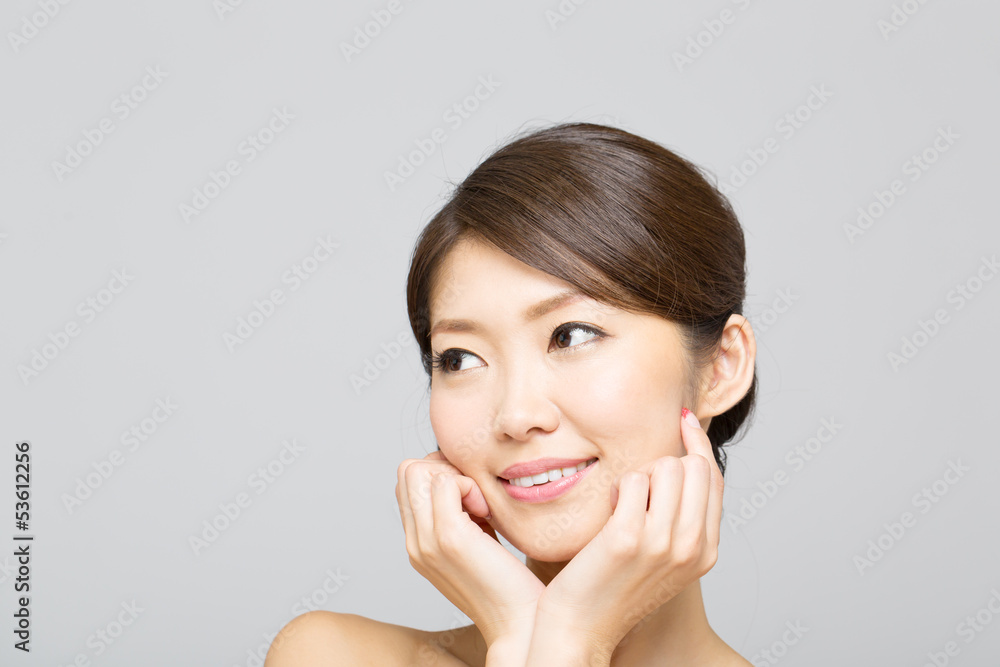 Beautiful asian woman isolated on gray background Beautiful asian woman isolated on gray background