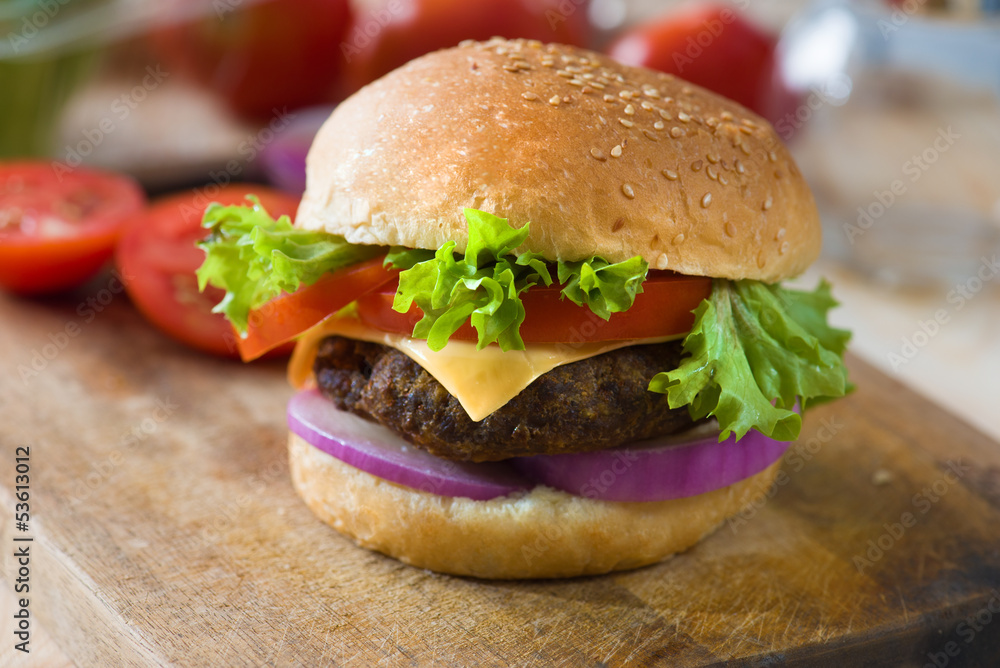 hamburger fast food with plenty of raw materials on the backgrou hamburger fast food with plenty of raw materials on the backgrou