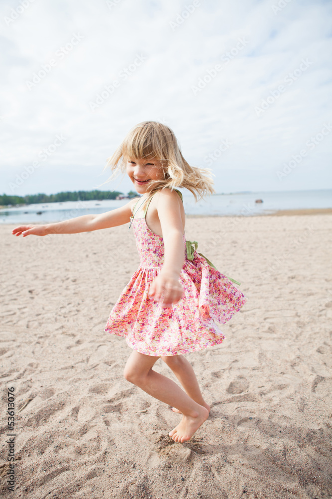 Smiling young girl having fun at beach Smiling young girl having fun at beach