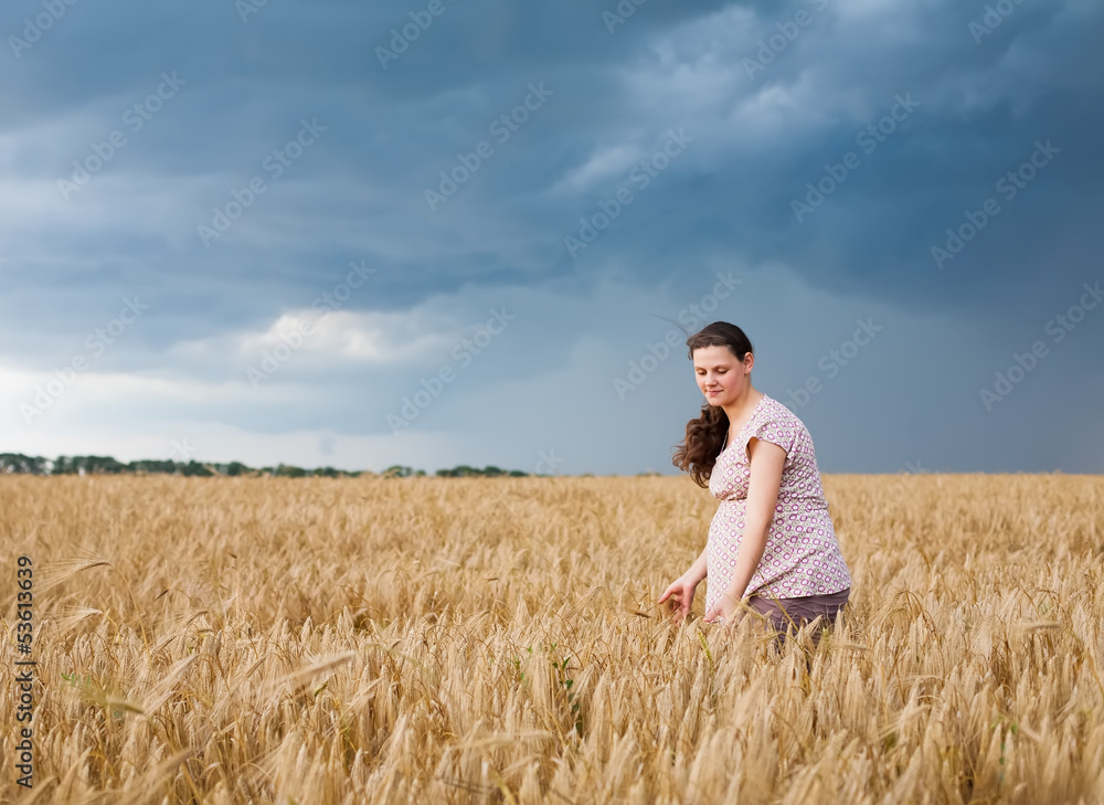 Young pregnant woman on wheat field Young pregnant woman on wheat field
