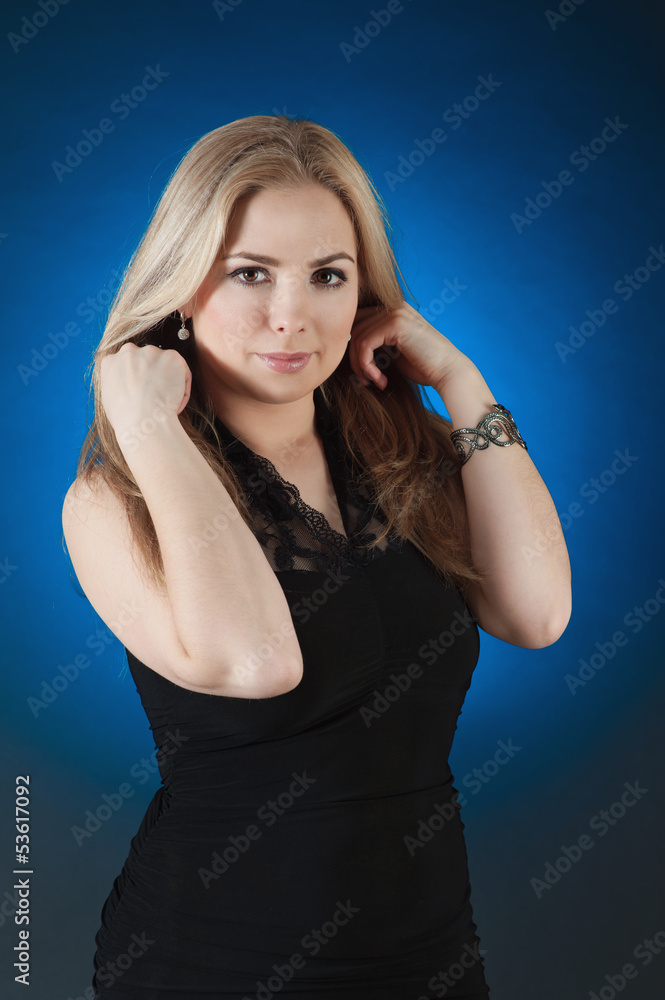 Charming girl, isolated on a blue gradient Charming girl, isolated on a blue gradient