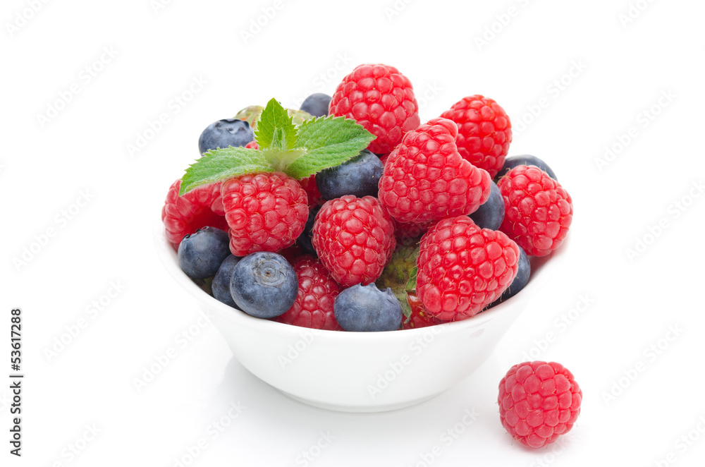 bowl with fresh juicy berries and mint isolated bowl with fresh juicy berries and mint isolated