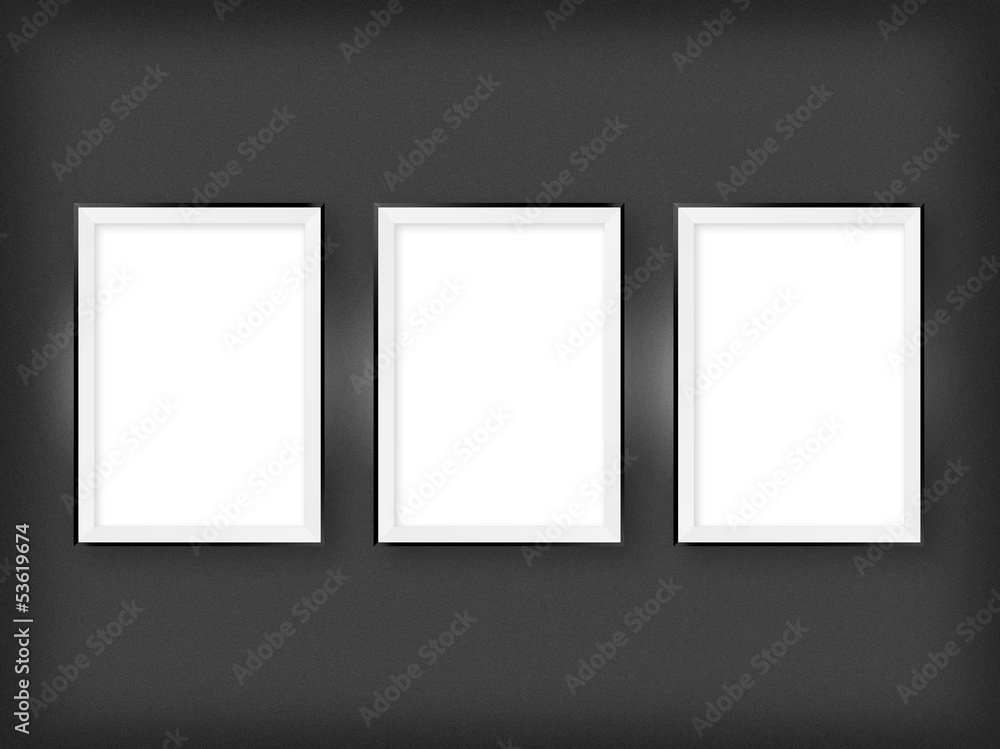 Three empty frames on a wall Three empty frames on a wall