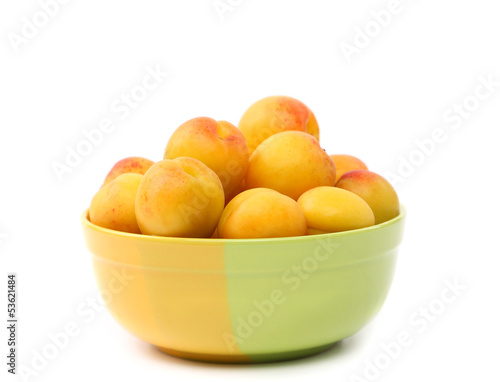 Fresh apricots in cup isolated on white