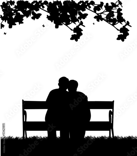 Retired elderly couple sitting on bench in garden or yard