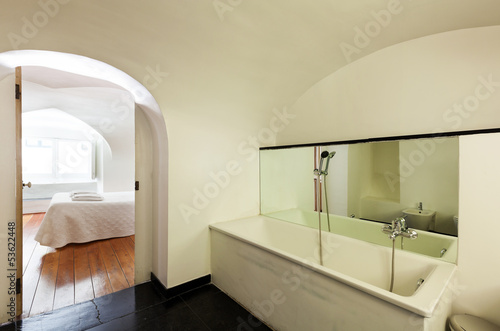 hotel in historic palace, interior, view bedroom from bathroom