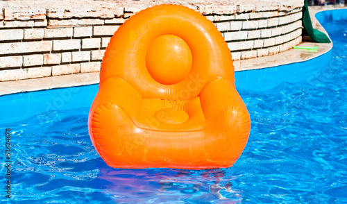 Inflatable armchair in the pool
