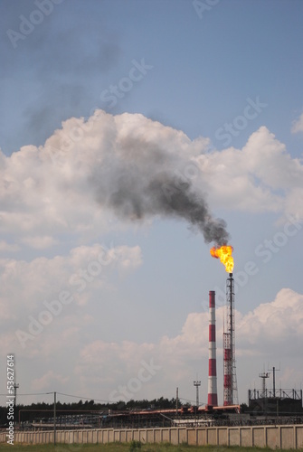 Industrial landscape with a burning torch in Kazan
