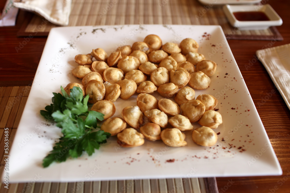 Plate of fried pelmeni