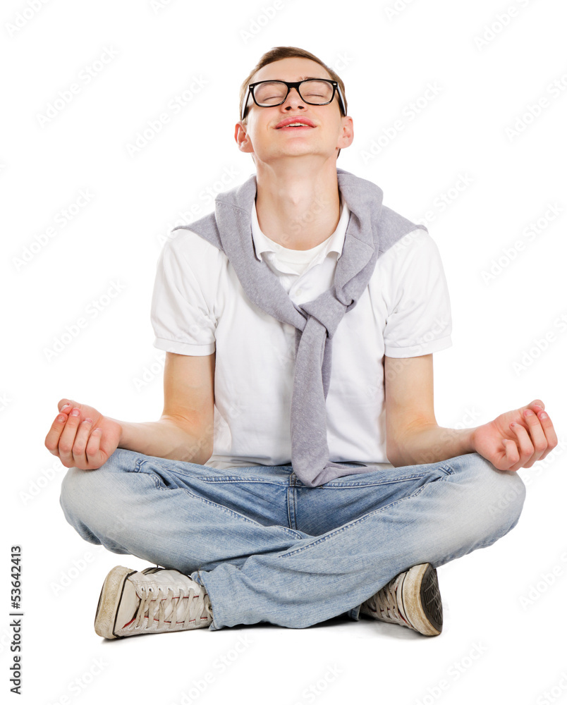 A young guy sitting on the floor, isolated on white background