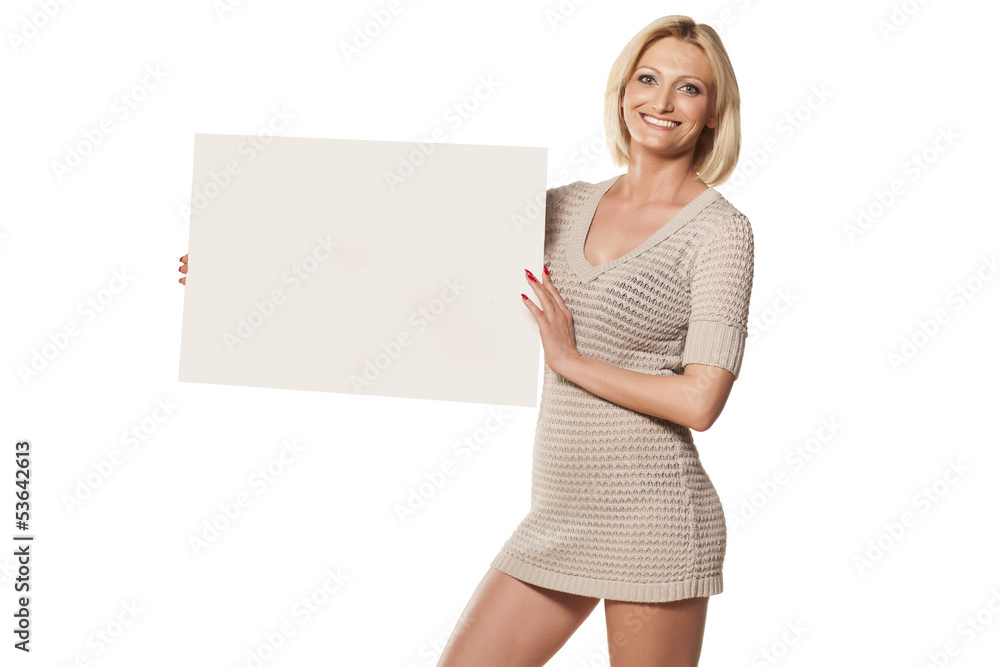 pretty blonde in a short dress holding an empty display pretty blonde in a short dress holding an empty display