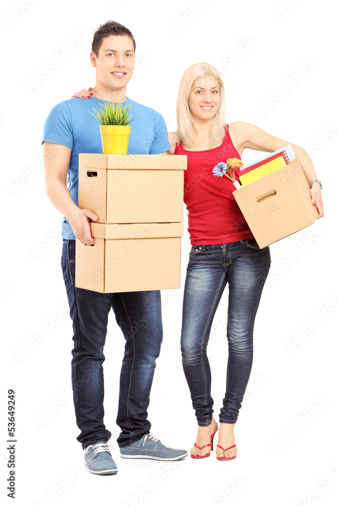 Full length portrait of a young male and female holding boxes Full length portrait of a young male and female holding boxes