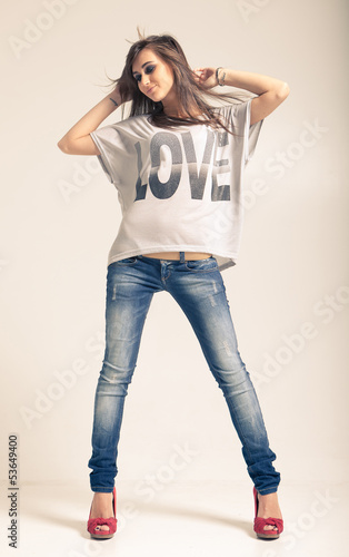 Woman wearing jeans and t-shirt with an inscription love