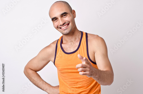 You can do this!Muscular bald man smiling pointing at you.