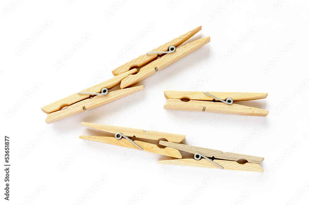 Five wooden clothespins isolated on white background Five wooden clothespins isolated on white background