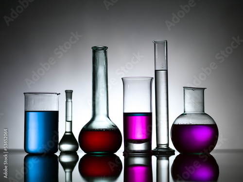 different lab bottles filled with colored substances
