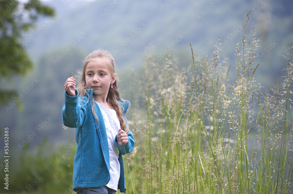 summer holidays: young girl outdoors in nature summer holidays: young girl outdoors in nature