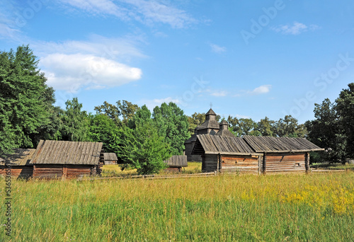 Ancient traditional ukrainian rural wooden barn and church