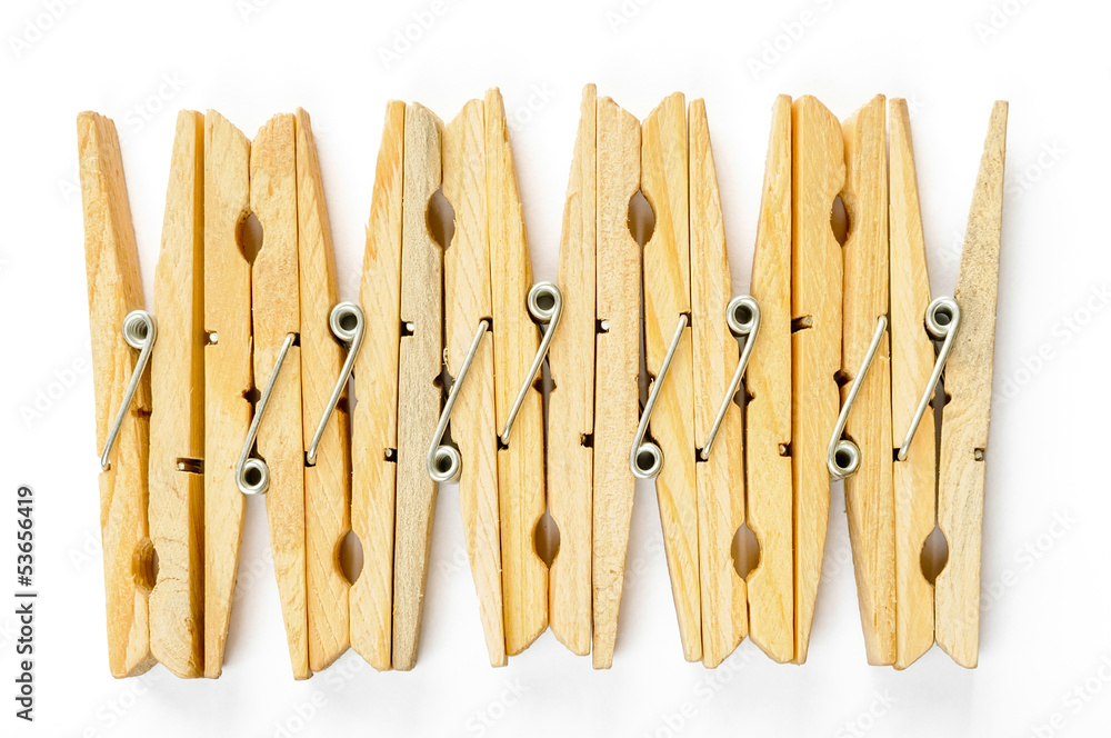 Nine wooden clothespins in row, isolated on white background Nine wooden clothespins in row, isolated on white background