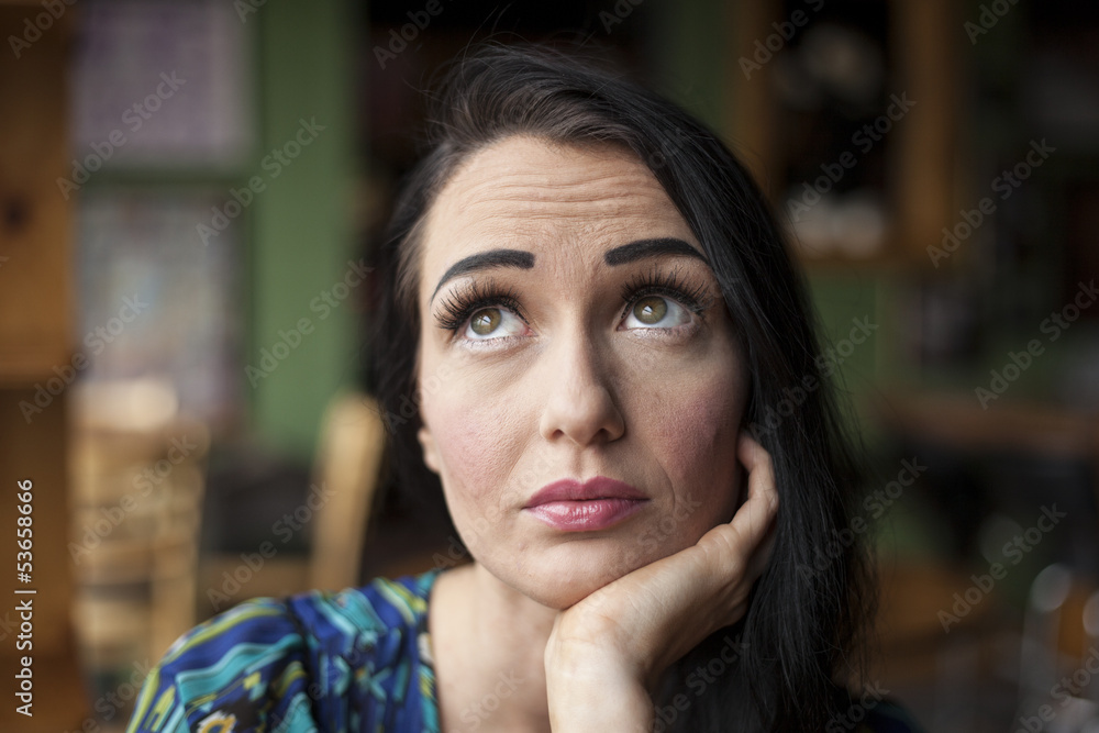 Beautiful Young Woman with Pensive Expression