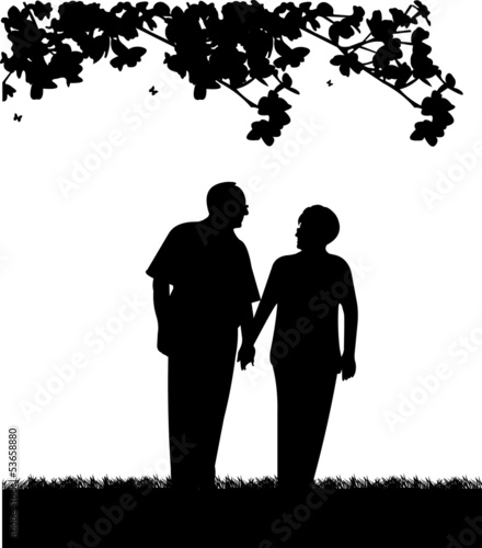 Lovely retired elderly couple walking in park silhouette