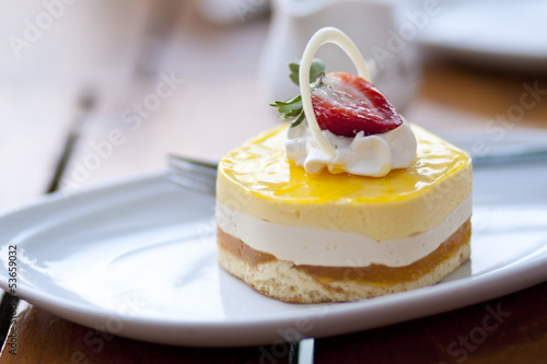 Tropical Mango Passion Fruit Mousse with strawberry in the toppi photo
