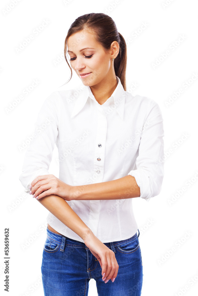 Young woman in white shirt turning up sleeves Young woman in white shirt turning up sleeves
