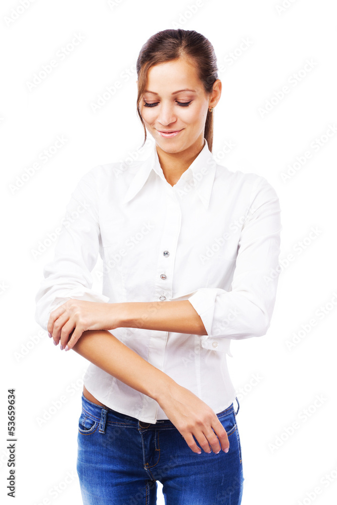 Young woman in white shirt turning up sleeves Young woman in white shirt turning up sleeves