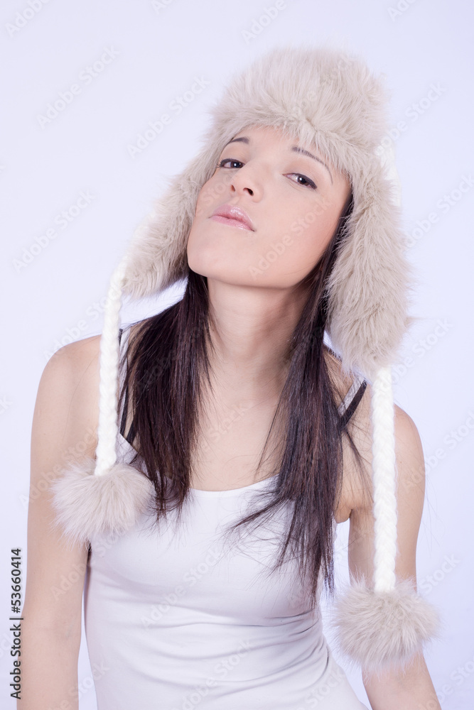 young woman wearing winter cap, fashion shot