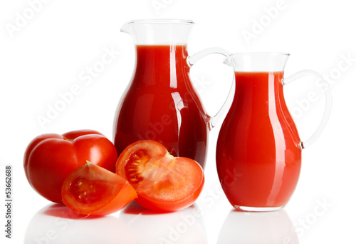 Tomato juice in pitchers isolated on white © Africa Studio
