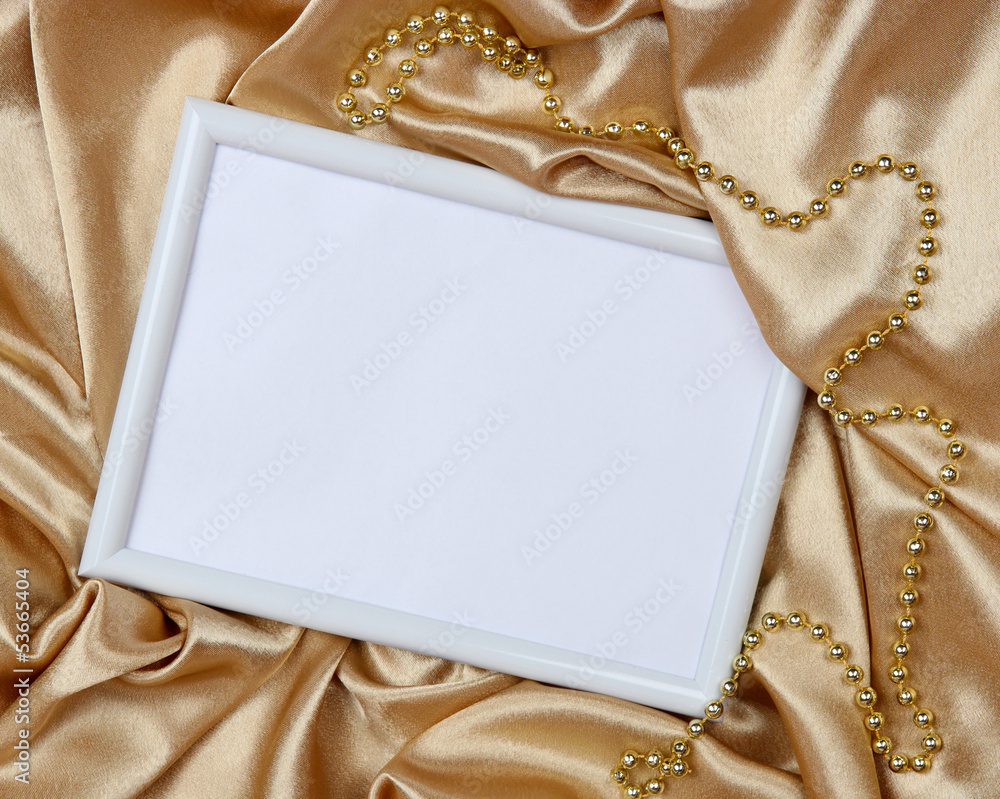 Fototapeta premium Empty frame on beautiful silk background