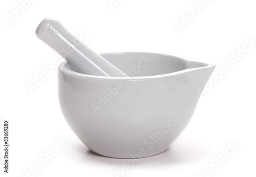 White mortar and pestle isolated on white photo