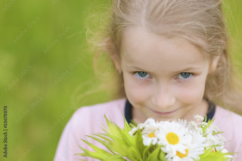closeup portrait of little caucasian girl with blue eyes holding closeup portrait of little caucasian girl with blue eyes holding