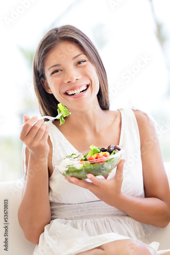 Salad - healthy eating woman laughing eating food