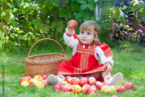  little girl with a basket of apples