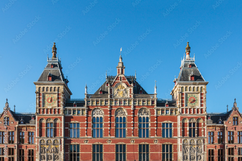 Facade of the ancient central train station in Amsterdam