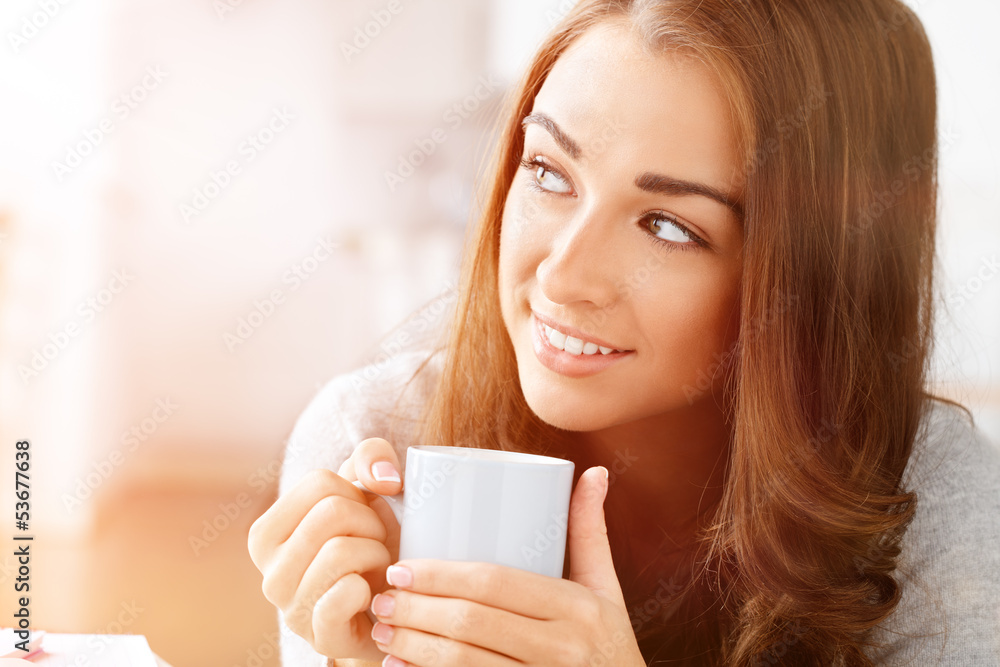 Attractive woman drinking coffee at home Attractive woman drinking coffee at home
