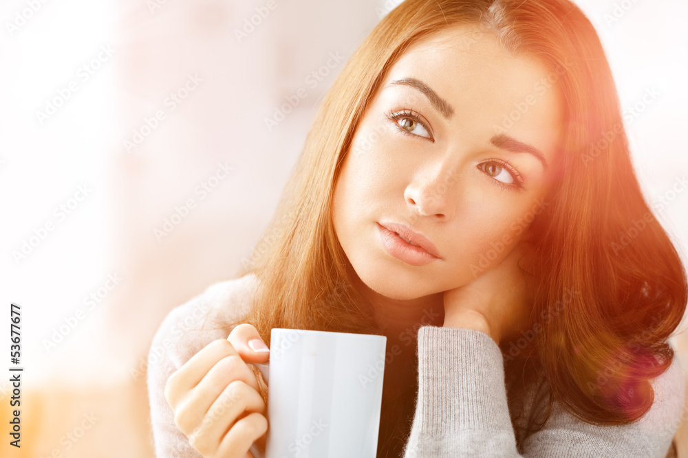 Attractive woman drinking coffee at home Attractive woman drinking coffee at home