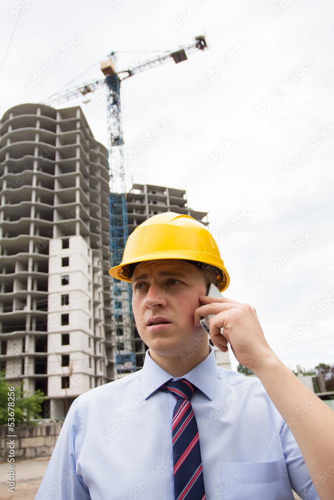 man in a hard hat talking on the phone man in a hard hat talking on the phone